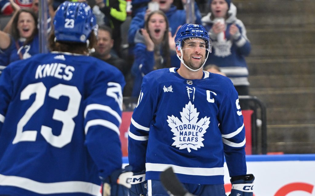Oct 2, 2023; Toronto, Ontario, CAN; Toronto Maple Leafs forward John Tavares (91) celebrates with forward Matthew Knies (23) after scoring a goal against the Montreal Canadiens in the third period at Scotiabank Arena. Mandatory Credit: Dan Hamilton-USA TODAY Sports